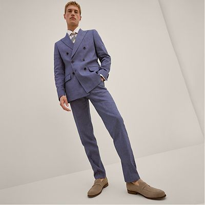 Man wearing blue linen summer suit. Shop men’s suits 
