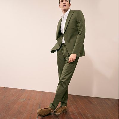 Man wearing green summer suit. Shop men’s suits 