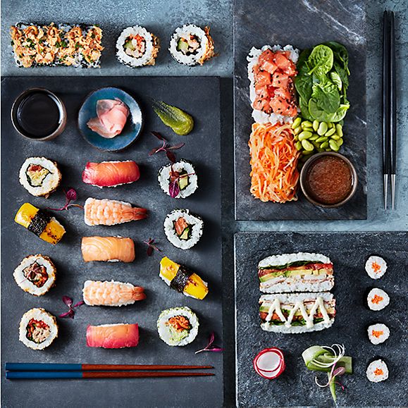 Selection of sushi, poke salad and soy