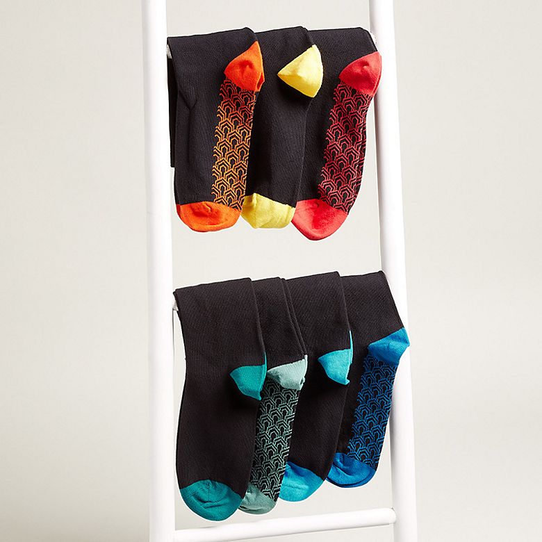 Multi-coloured men’s socks arranged on ladder