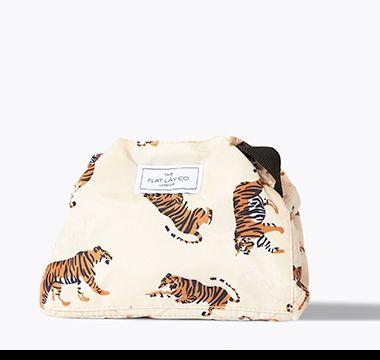 Lay flat tiger-print make-up bag. Shop beauty gifting 