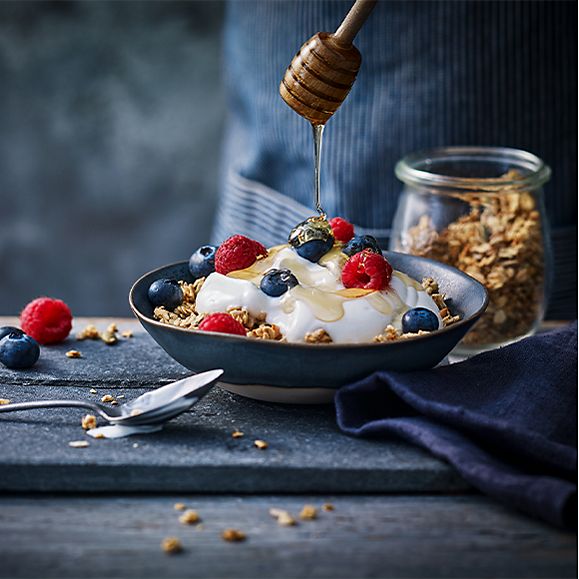 Greek-style yoghurt topped with fresh fruit and granola