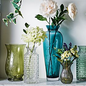 Coloured glass vase and flowers