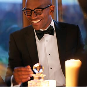 Man wearing black dinner jacket tuxedo