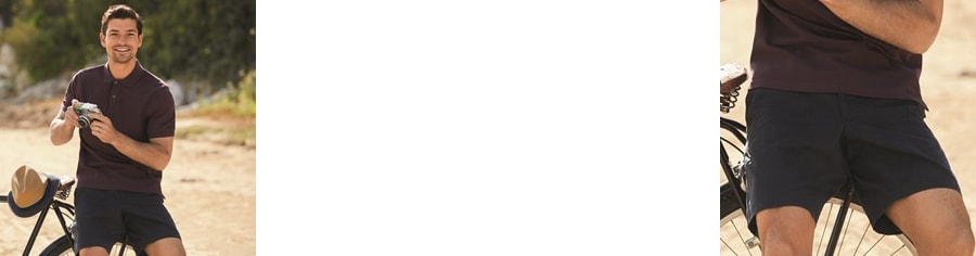 Man sitting on the back of the bicycle with a camera in his hand