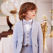 Boy in pale blue suit and bow-tie