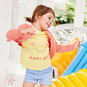 Girl wearing yellow T-shirt, blue shorts and a pink hoody