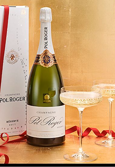 A magnum of Pol Roger champagne and Noveau champagne saucers