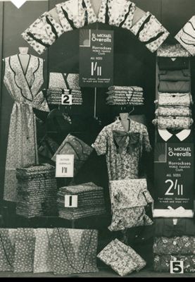 Women’s workwear overalls displayed in an M&S shop window, 1930s