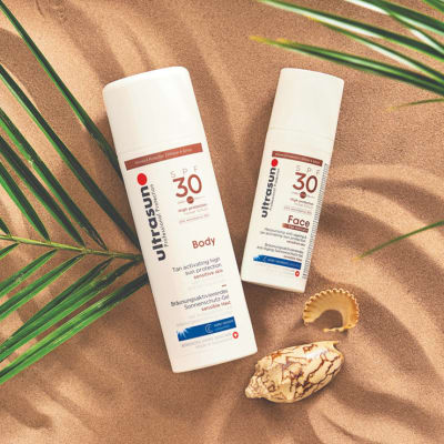 Ultrasun sun creams in the sand