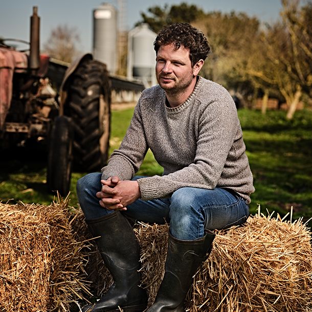 M&S chicken farmer Andy Darch sat on hay bale