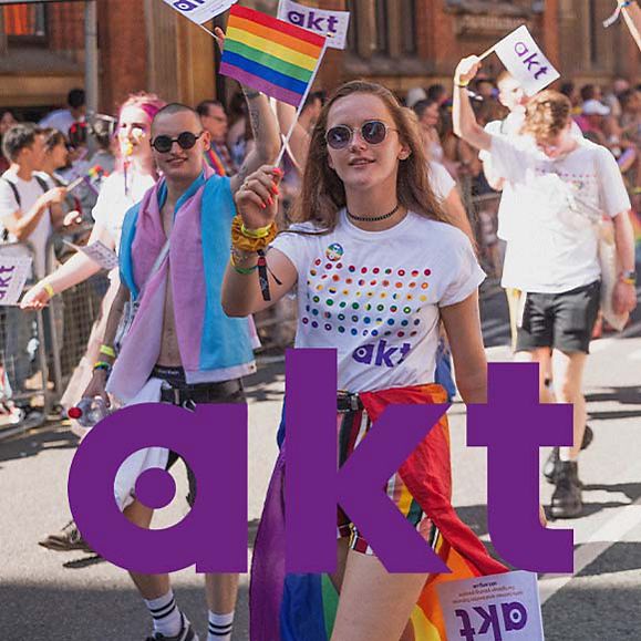 People waving akt flags at a Pride event