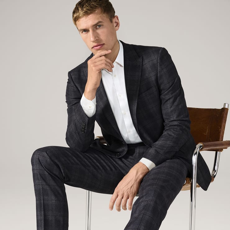 Man wearing tailoring and knitwear. Shop workwear