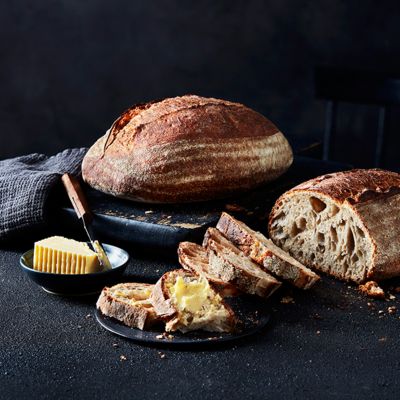 Handcrafted sourdough loaf with butter
