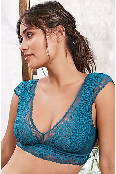 Woman wearing a turquoise leopard-print lace bralet