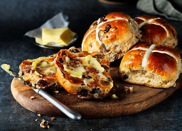 Luxury M&S hot cross buns on a board