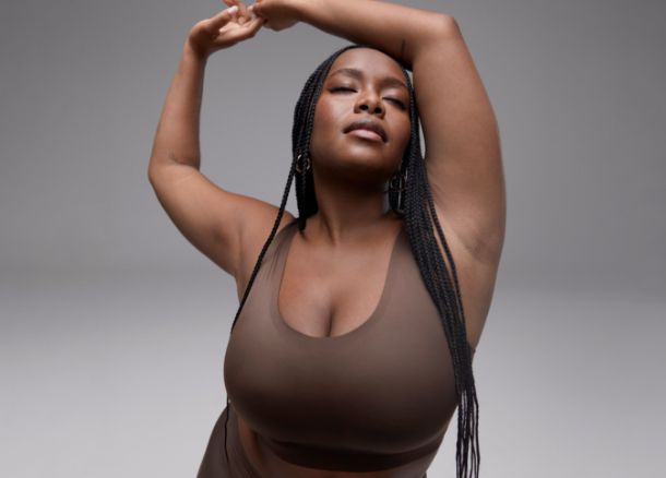 Woman wearing brown bra. Book a classic bra fit