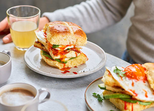 Extremely cheesy hot cross buns filled with avocado, halloumi and fried egg