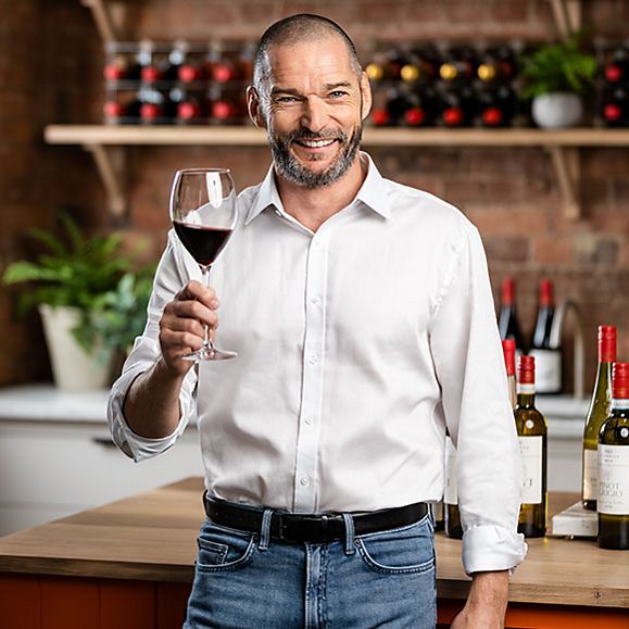 Fred Sirieix with a glass of red wine