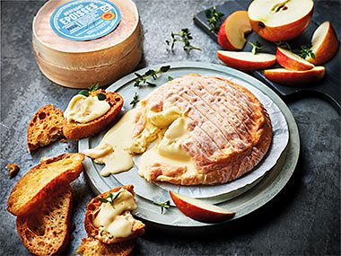 Wheel of Berthaut Epoisses with toasted bread and apple slices