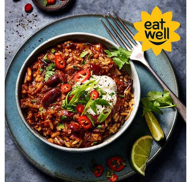 Bowl of M&S Eat Well chilli with fork and sliced chillies