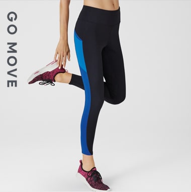 Woman wearing black leggings with side-stripe