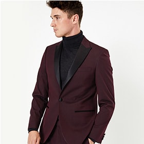 Man wearing burgundy suit