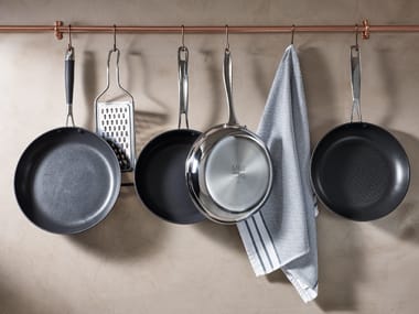 Pots and pants hanging on a rail