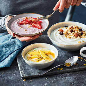 Yoghurts with fresh fruit and nut toppings