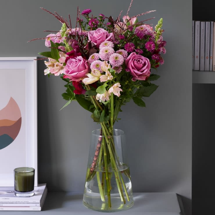 Bouquet of flowers in a glass vase. Send flowers