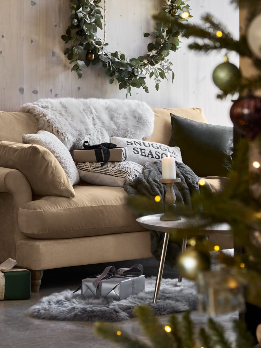 Christmas tree in a festive living room. Shop Christmas collection