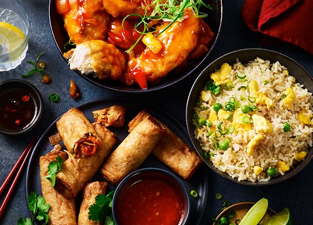 Sweet and sour chicken, spring rolls and rice