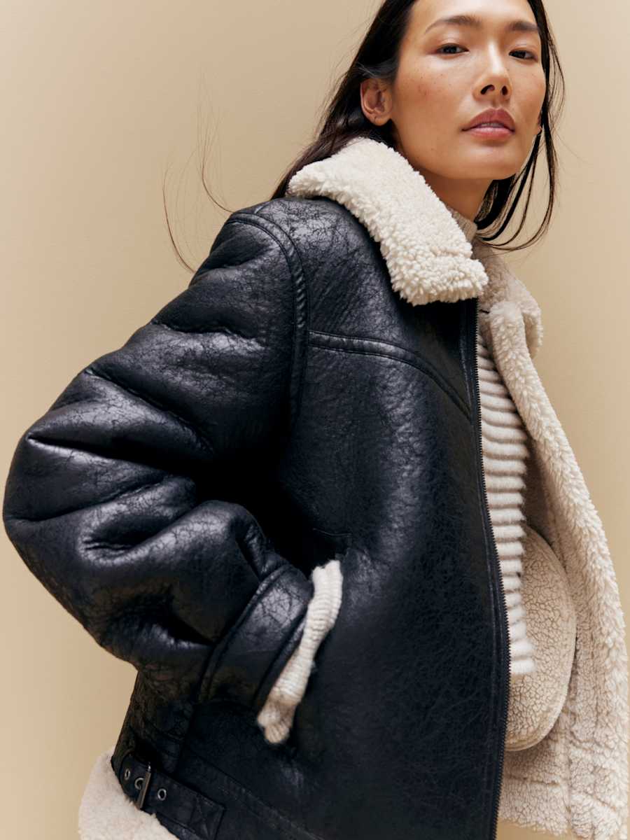 Woman wearing Fair Isle jumper. Shop women’s knitwear