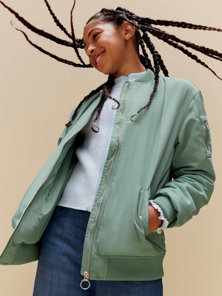 Man wearing padded jacket. Shop men’s coats