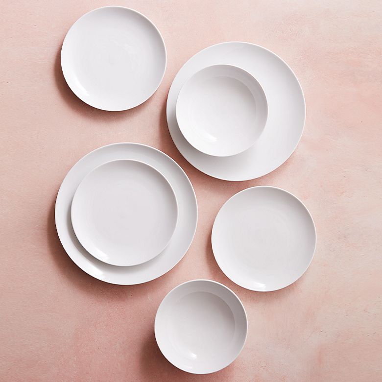 Plain white porcelain dinner plates, side plates and bowls