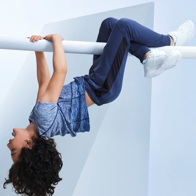 Child wearing Goodmove blue T-shirt and joggers