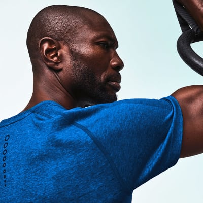 Man wearing short-sleeved blue T-shirt