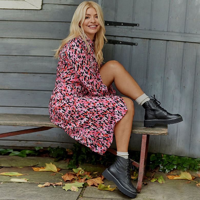 Holly Willoughby wearing a pink animal print midi dress. Shop women’s new in