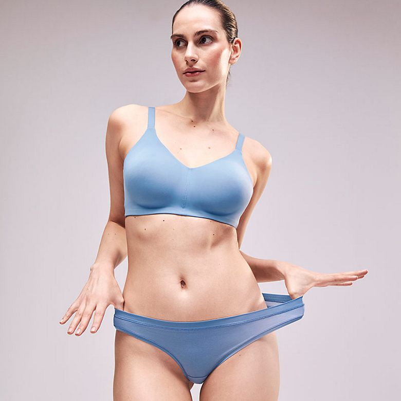 Woman wearing blue bra and matching briefs from the Flexifit range. Shop the bra 