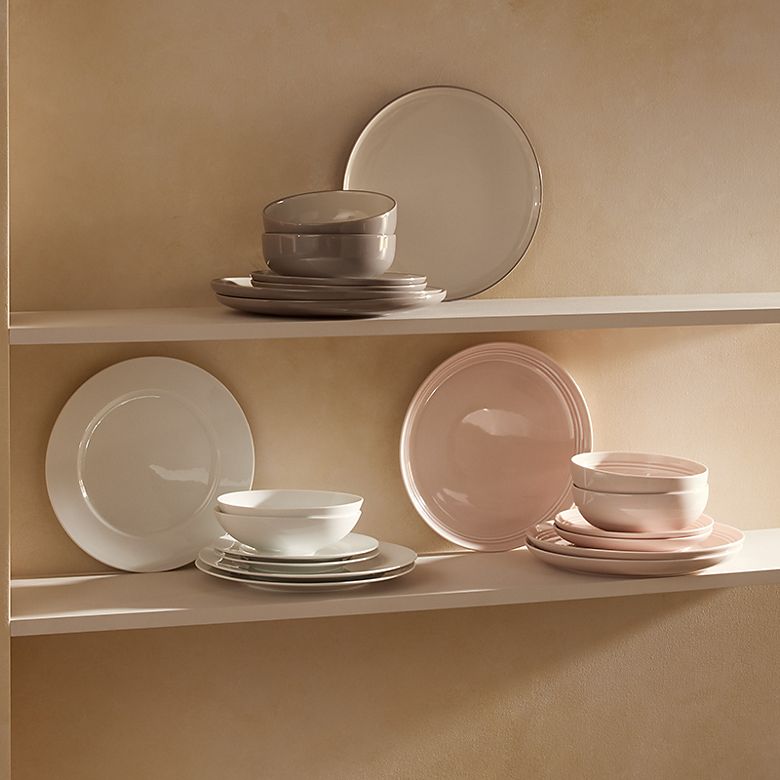 Set of white plates, bowls and cutlery. Shop all tableware 