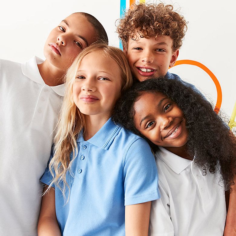 Children wearing assorted school shirts, blouses and polo shirts. Shop school uniform 