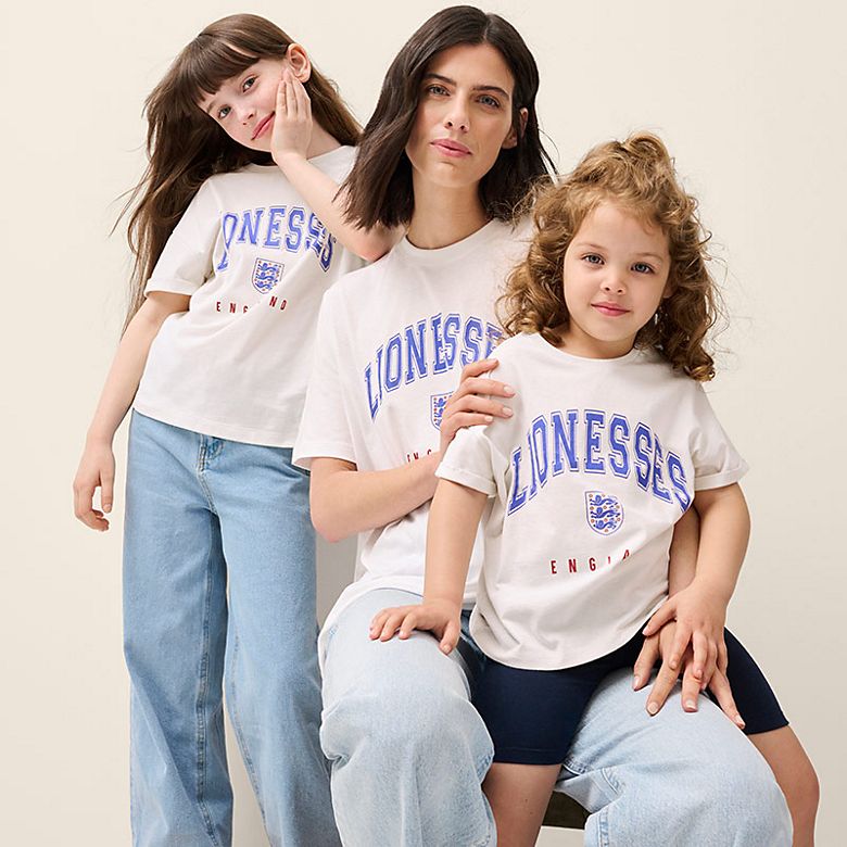 Women and two children wearing Lionesses t-shirts. Shop all match day buys 
