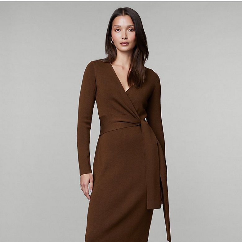 Woman wearing brown knitted wrap dress by Jaeger. Shop dresses