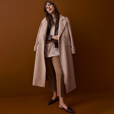 Why the patent trench coat is this season's key cover-up