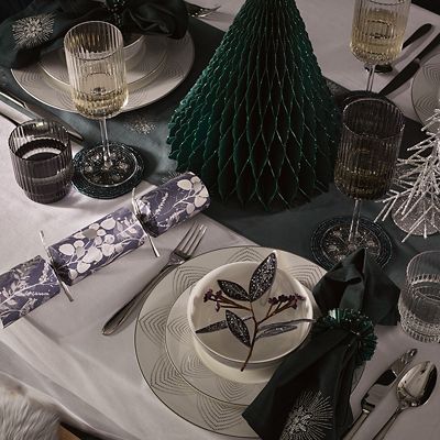 Create a wintry tablescape with white plates and napkins., How to Have the  Most Magical Harry Potter Christmas