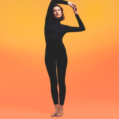 Woman wearing black thermal top and leggings. Shop thermal leggings