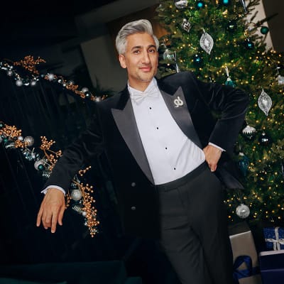 M&S Christmas advert star, Tan, wearing M&S black velvet blazer, white shirt and black tuxedo trousers. Shop the M&S Christmas advert 