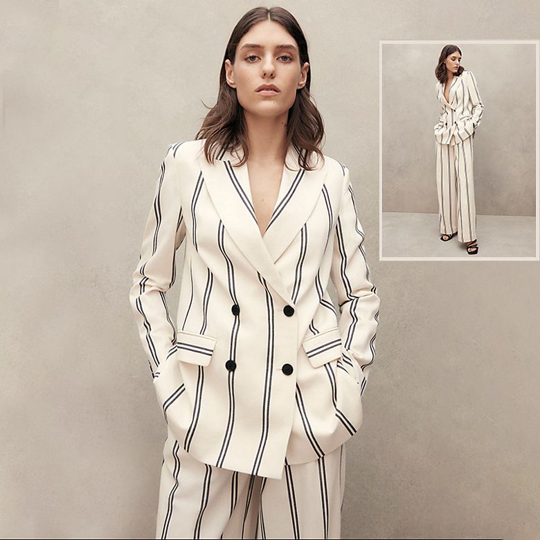    Woman wearing cream striped trouser suit. Shop women’s suits. 