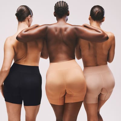 Three women wearing bum-boosting shapewear shorts. Shop now 