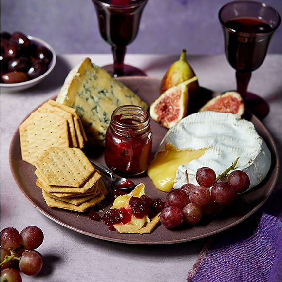 A cheeseboard with Made Without Wheat cheese crackers